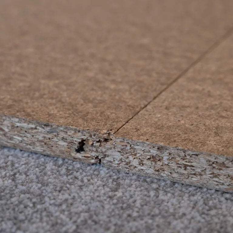 Close-up product image of loft board on a grey background