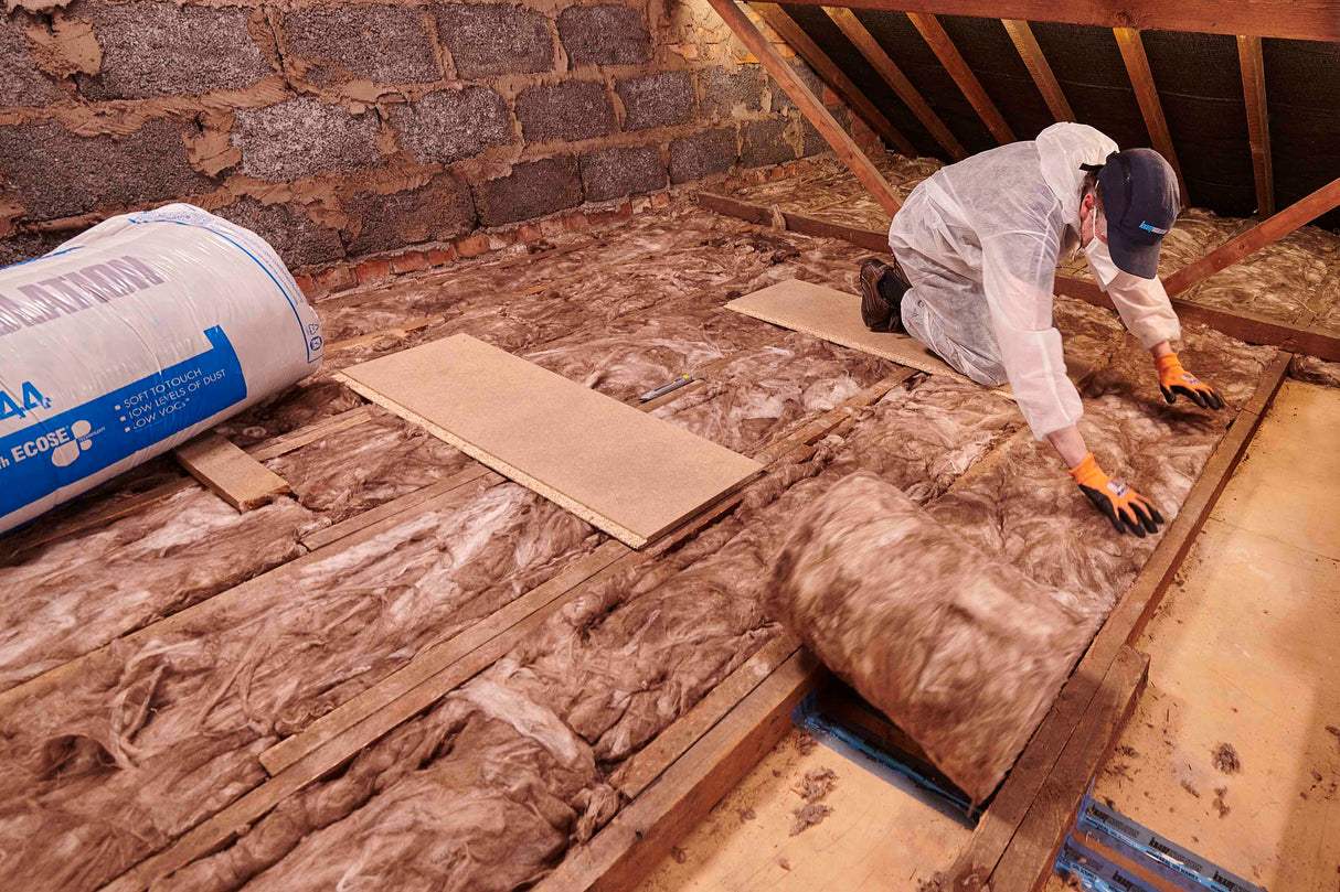 Person installing Knauf Loft Roll 44