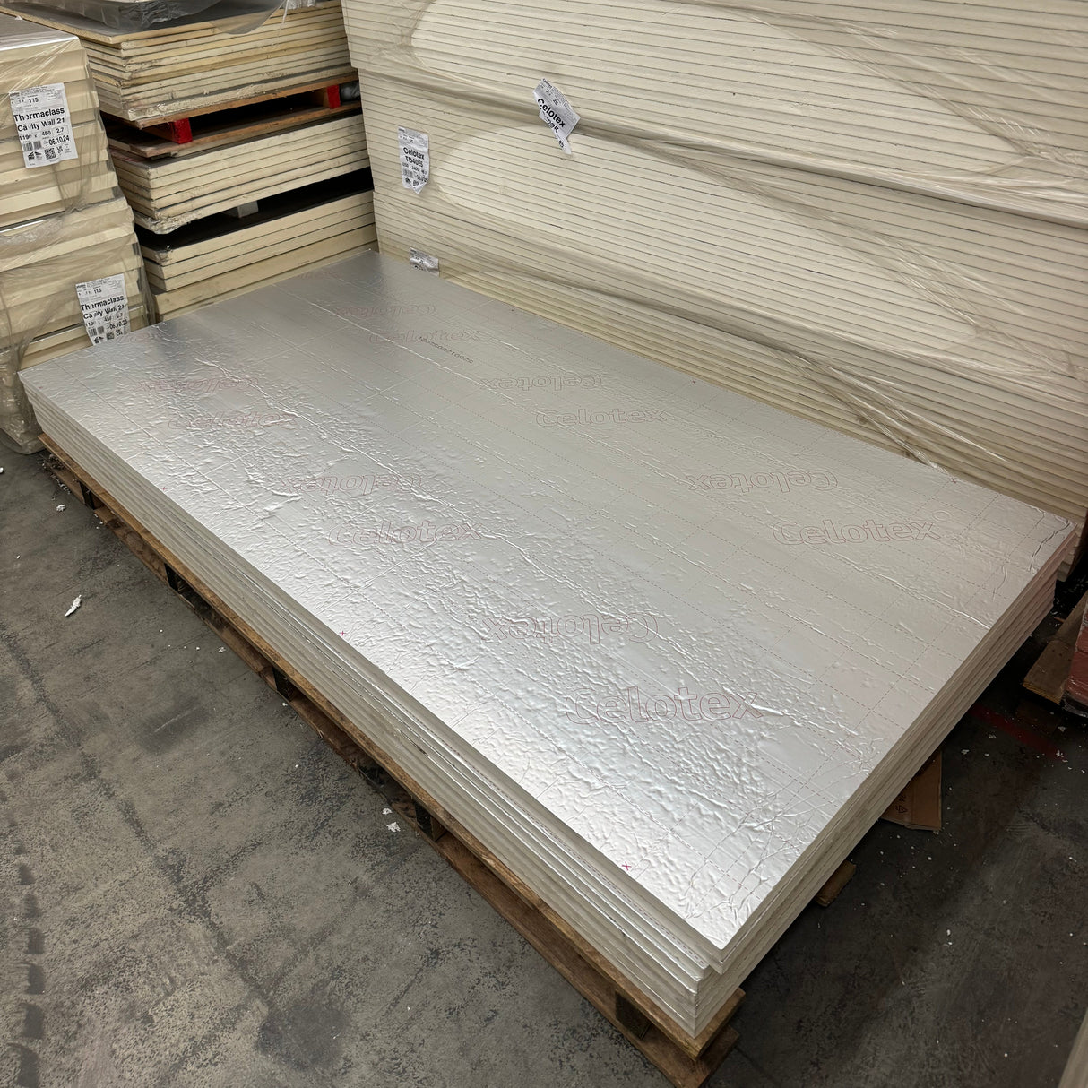 Photo of a large sheet on Celotex insulation board in a warehouse