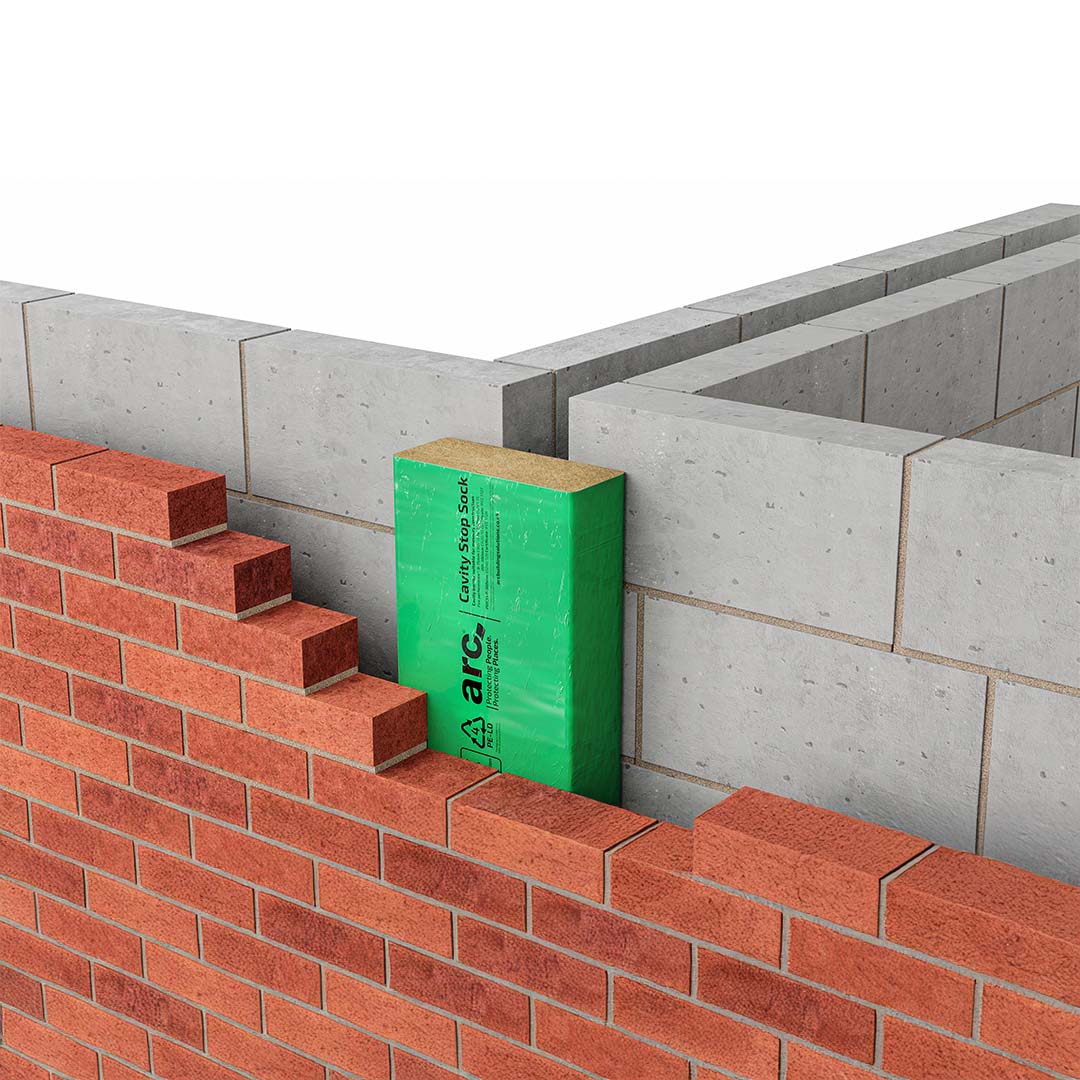 Brick wall construction with a green cavity stop sock labelled 'arc'.
