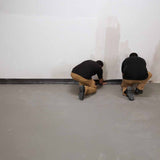 Two men installing the Danosa Peripheral Band